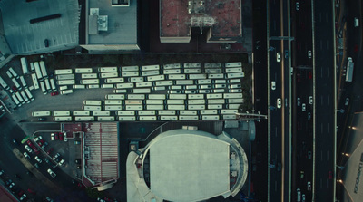 an aerial view of a parking lot in a city