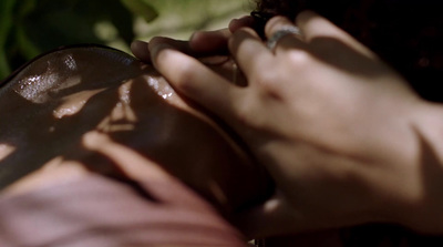 a close up of a person's hands holding a pair of scissors