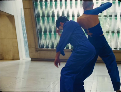 a man and a woman dancing in a dance studio