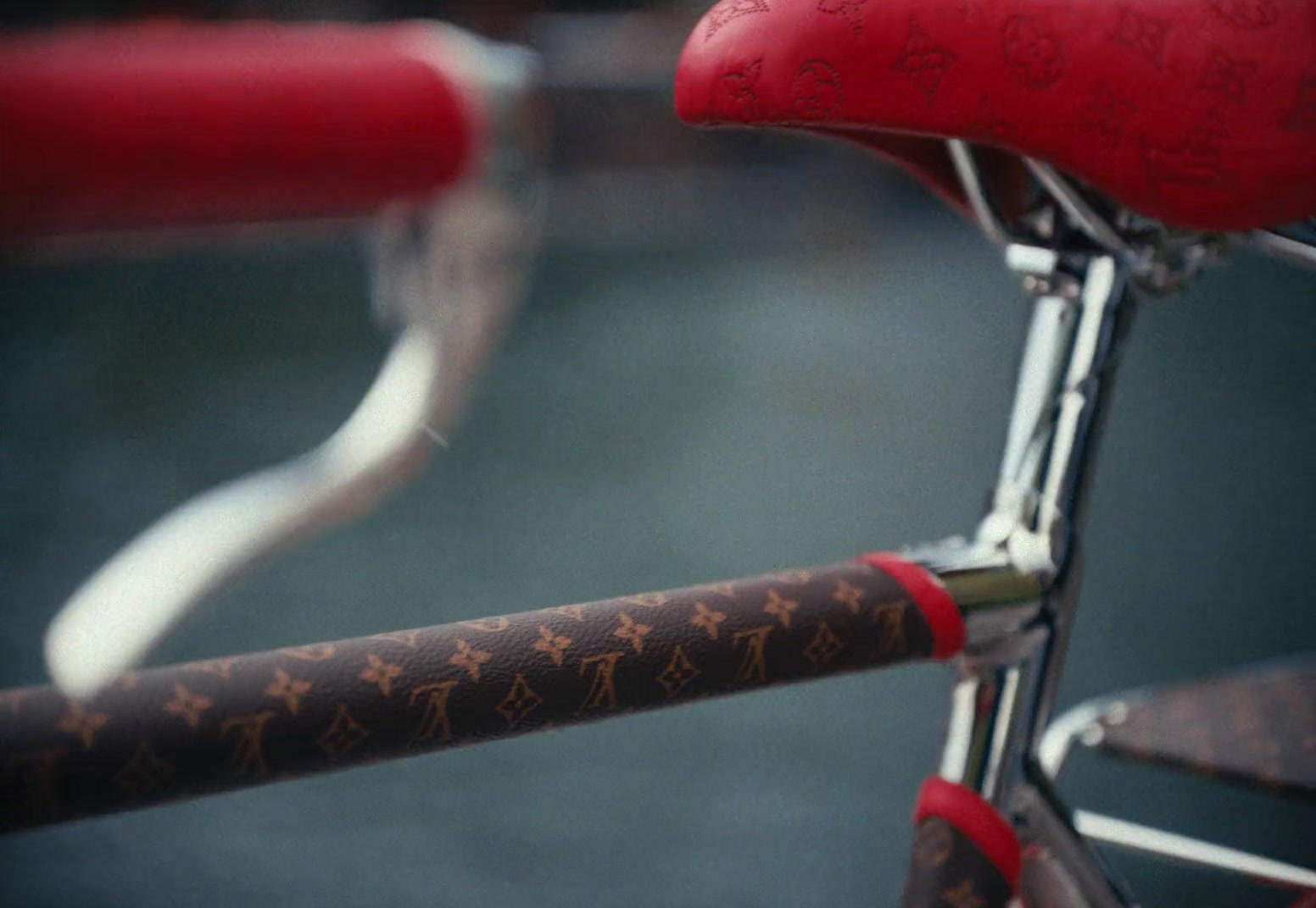 a close up of a bicycle with a red seat