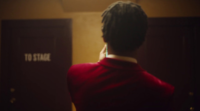 a woman standing in front of a door in a room