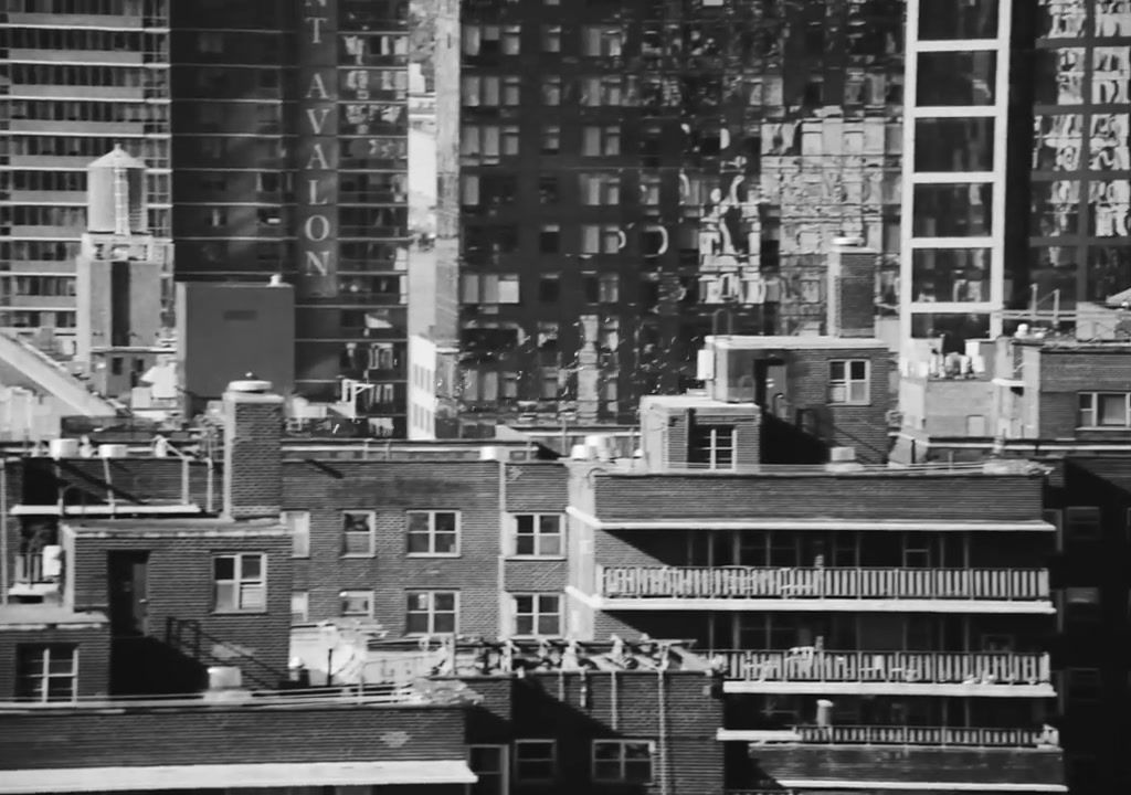 a black and white photo of buildings in a city