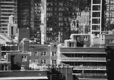 a black and white photo of buildings in a city