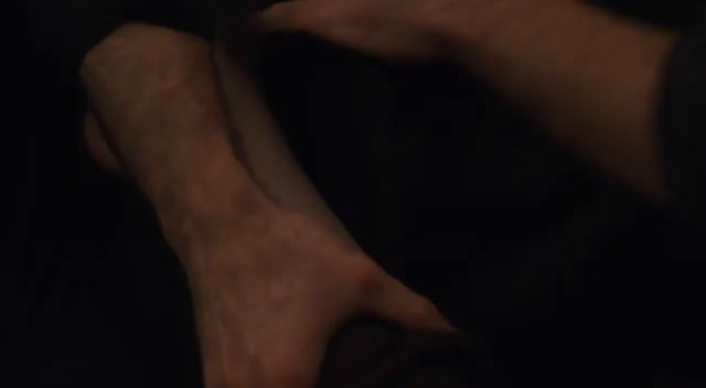 a blurry photo of a person's legs and feet