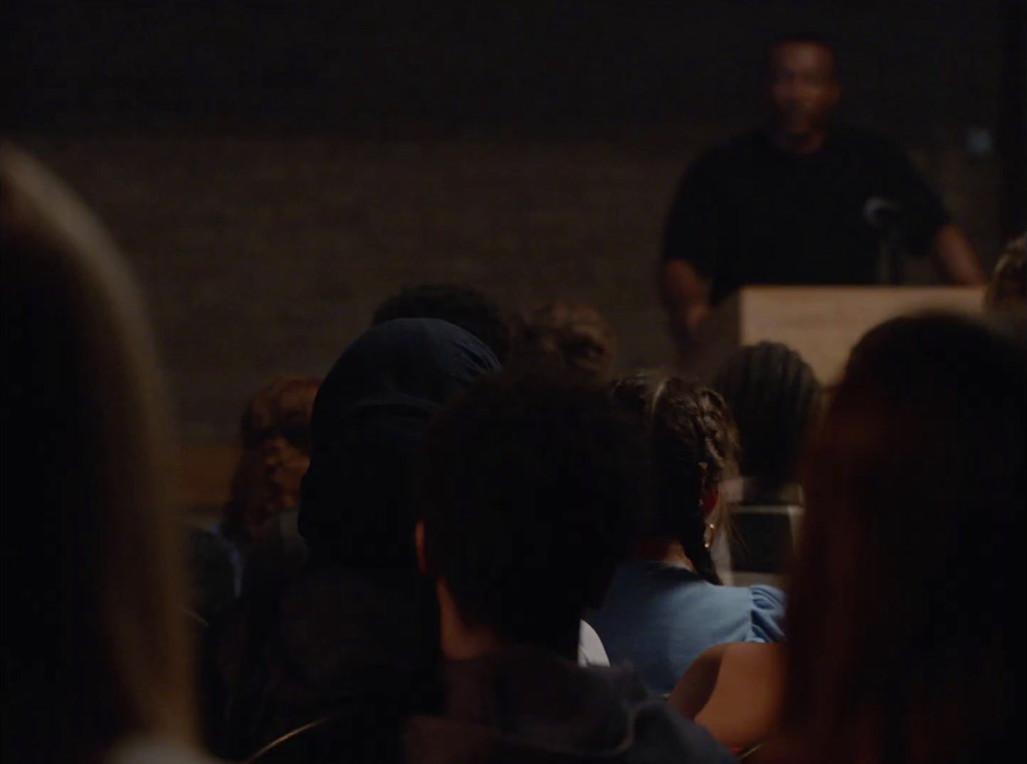 a man standing in front of a crowd of people