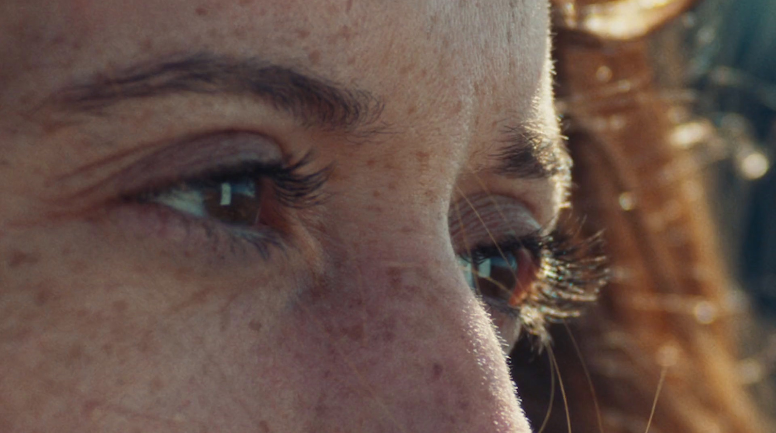 a close up of a person with freckles on their face