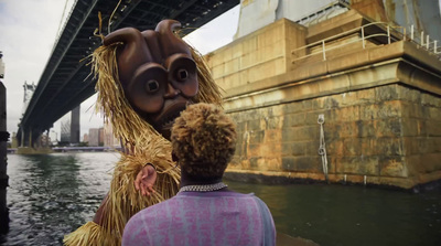 a man standing next to a woman near a bridge