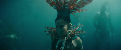 a woman with a weird headdress in the water