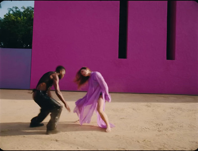 a couple of people that are standing in the dirt