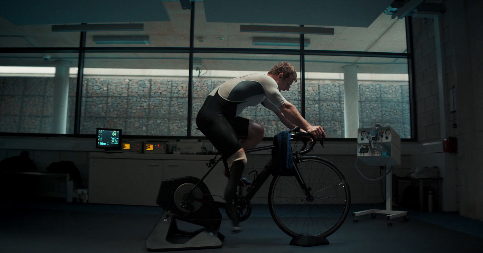 a man riding a bike inside of a building