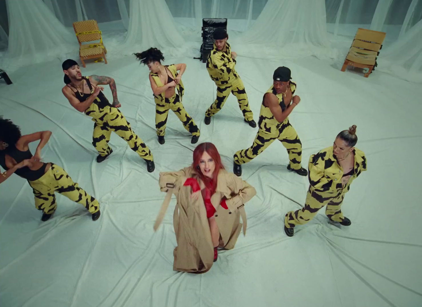 a group of women in yellow and black outfits