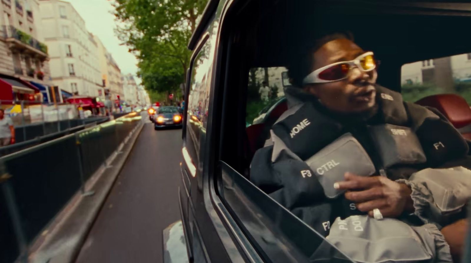 a man sitting in the back seat of a car