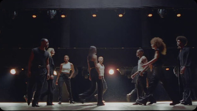 a group of people standing on top of a stage