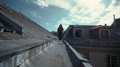 a person standing on the roof of a building