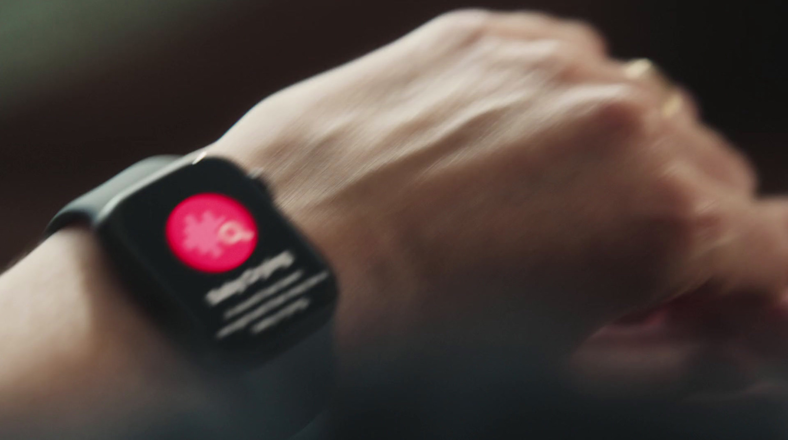 a close up of a person wearing a smart watch