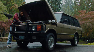 a man standing in the back of a truck