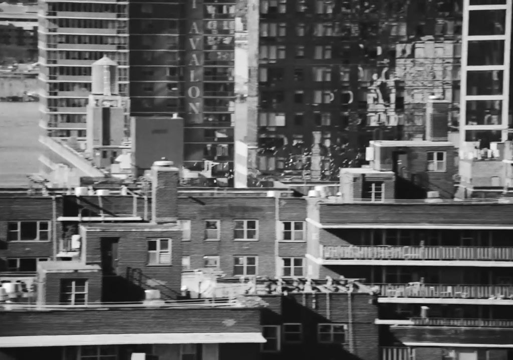 a black and white photo of buildings in a city