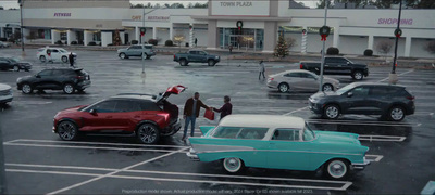 a parking lot filled with lots of parked cars