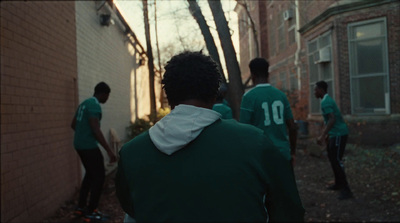 a group of young men playing a game of frisbee