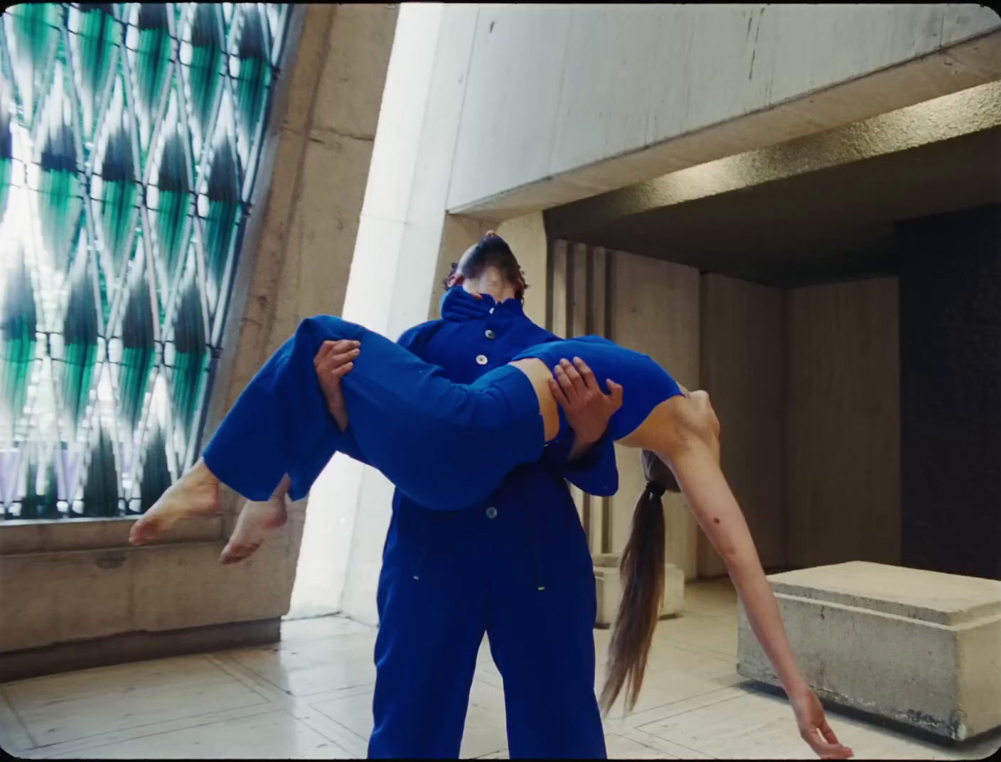 a man and a woman are doing acrobatic tricks