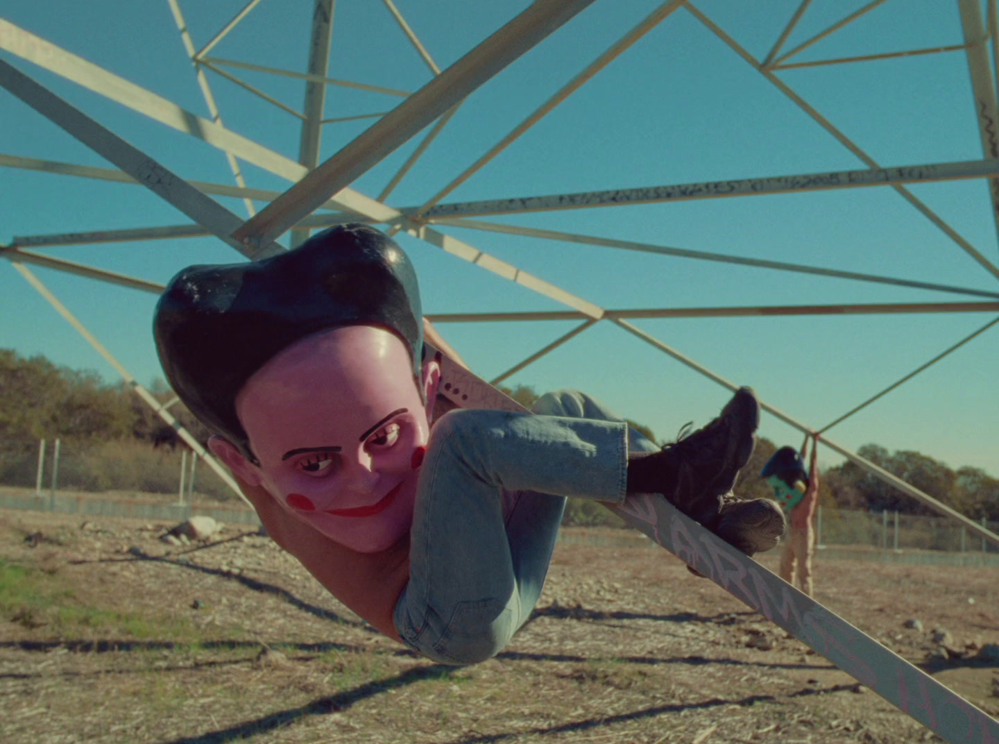 a man upside down on a metal structure