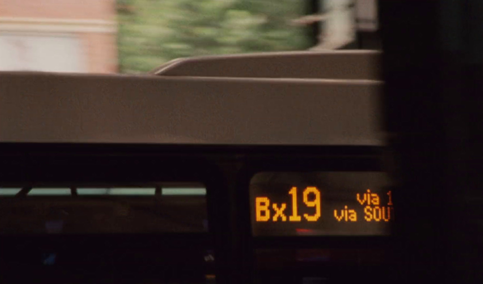 a close up of a bus on a city street