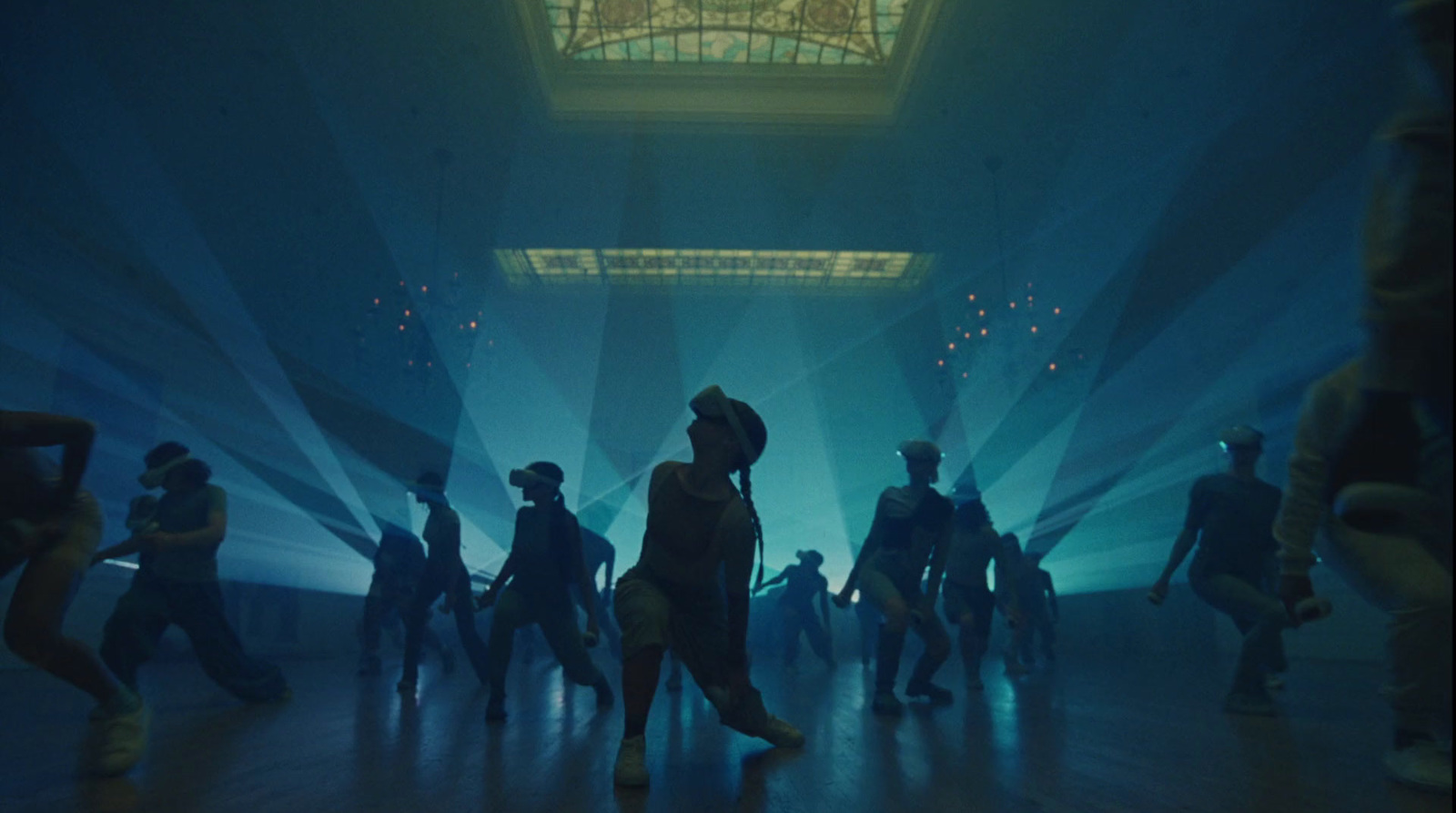 a group of people dancing in a dark room