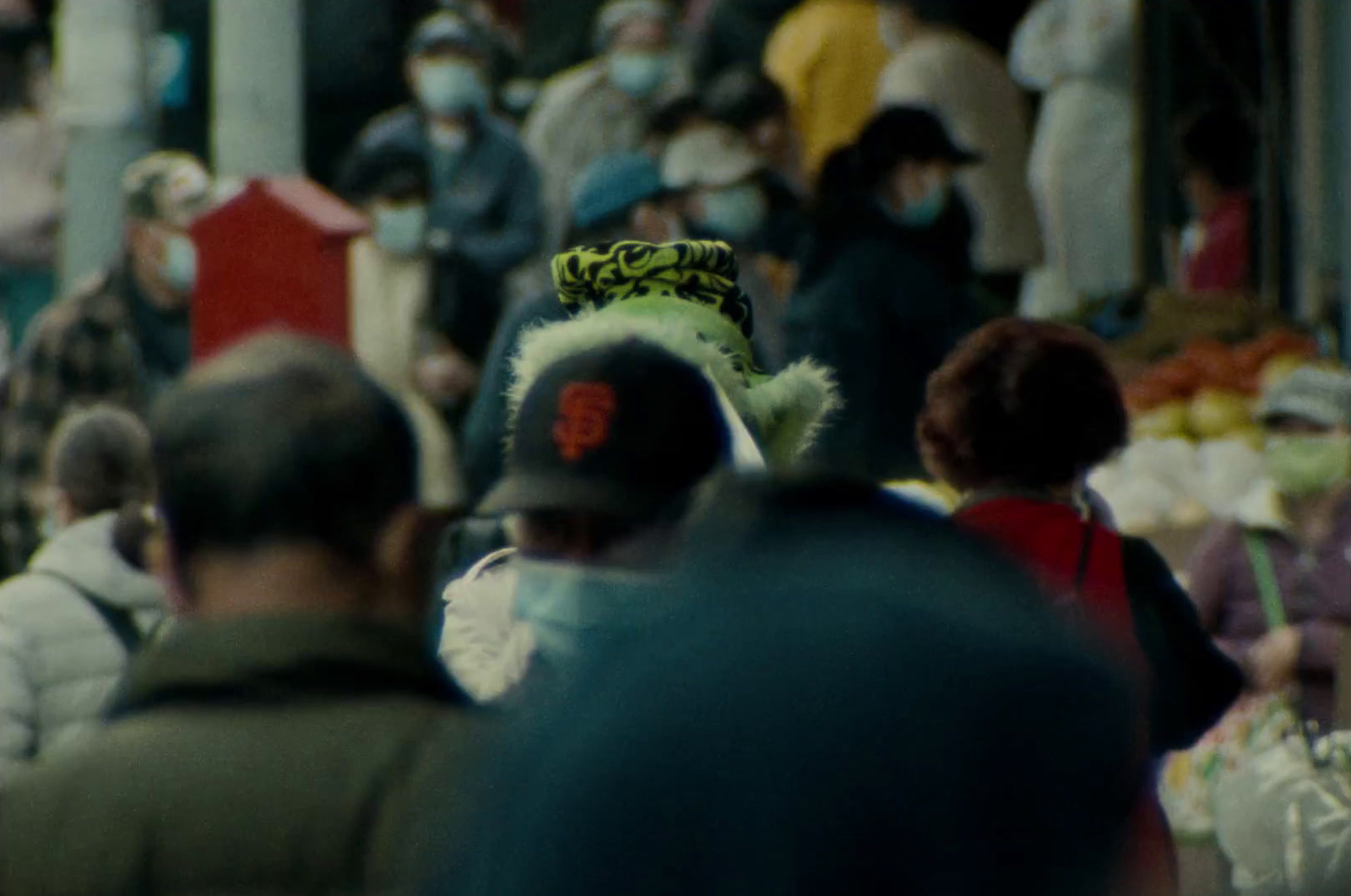 a crowd of people walking down a street