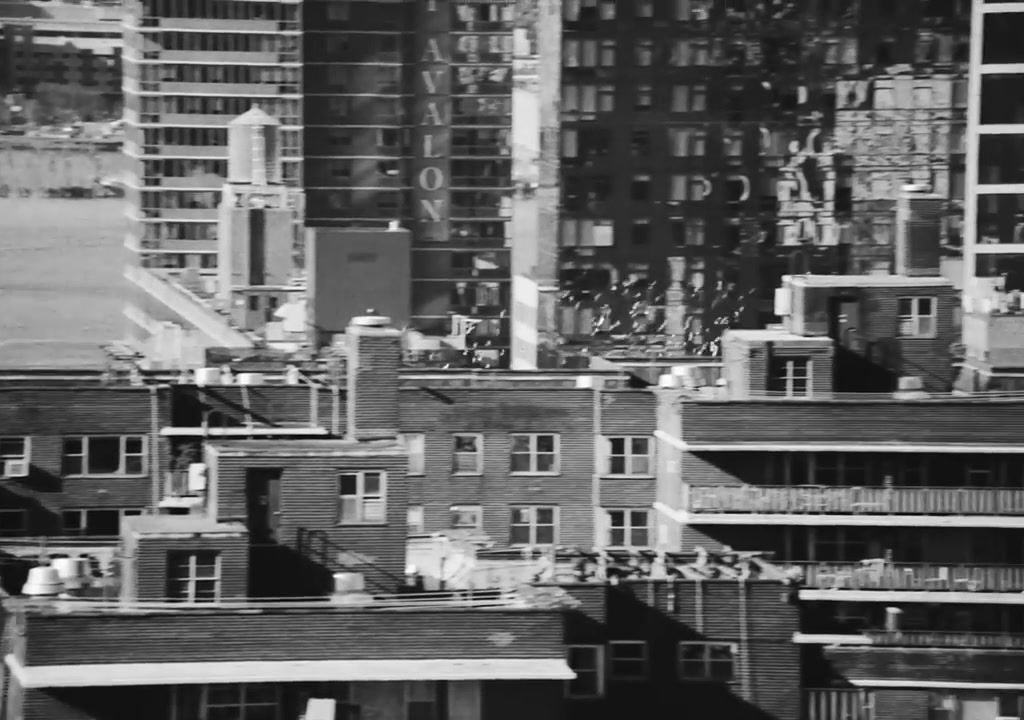 a black and white photo of buildings in a city