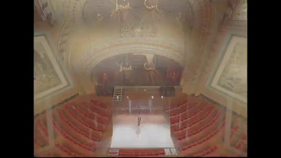 a blurry image of a person walking down a hall