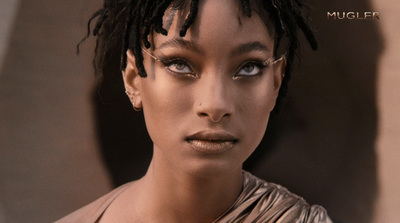 a close up of a person with dreadlocks