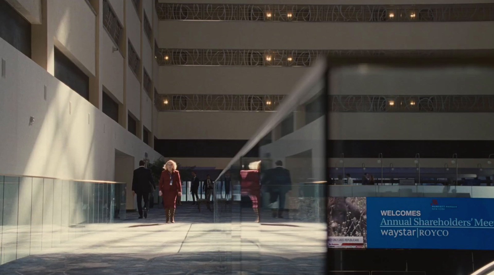 a group of people walking down a hallway