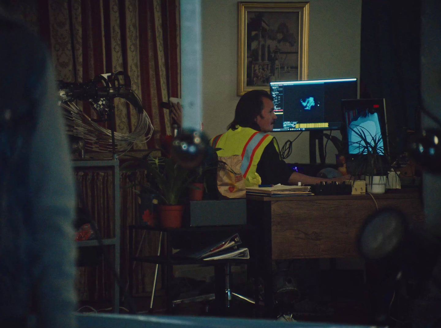 a man sitting at a desk in front of a computer