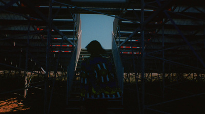 a person standing on a scaffold in front of a building