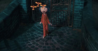 a cartoon character standing in front of a gate