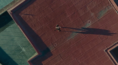 a person standing on a tennis court holding a racquet