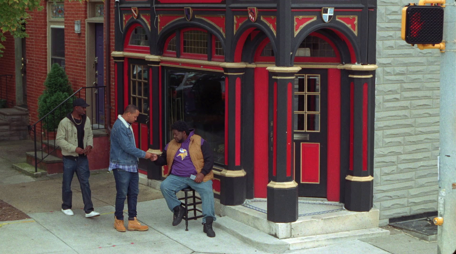 a man and a woman standing outside of a building