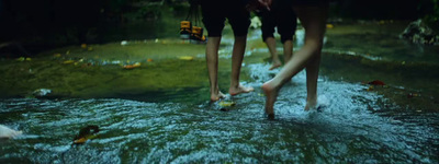 a couple of people that are standing in some water