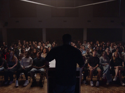 a man standing in front of a crowd of people