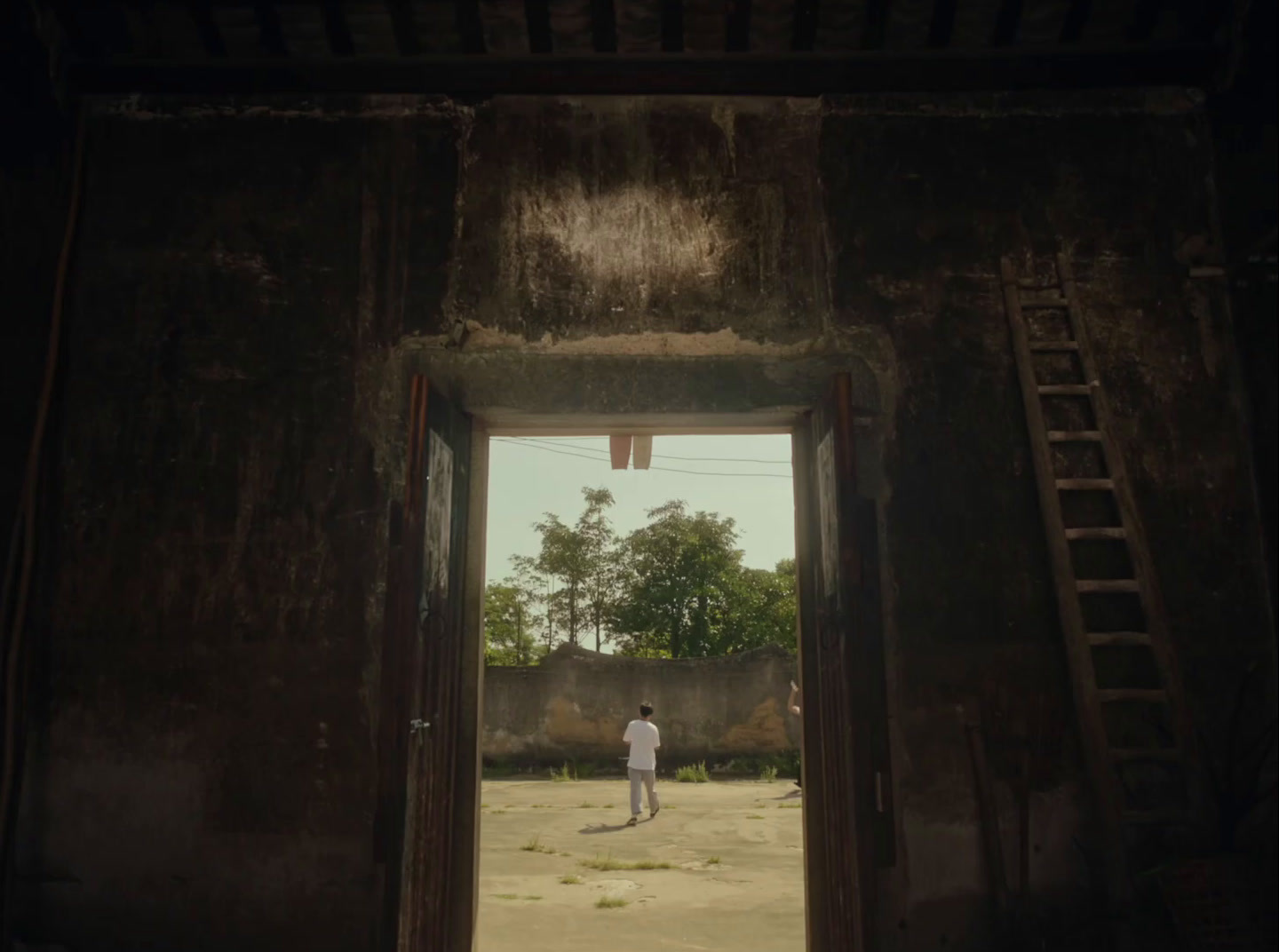 a man standing in a doorway of an old building