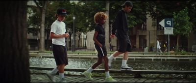 a group of young men walking down a street