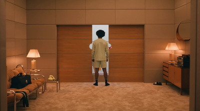 a man standing in front of a mirror in a room