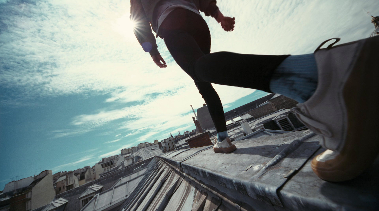 a man riding a skateboard on top of a roof