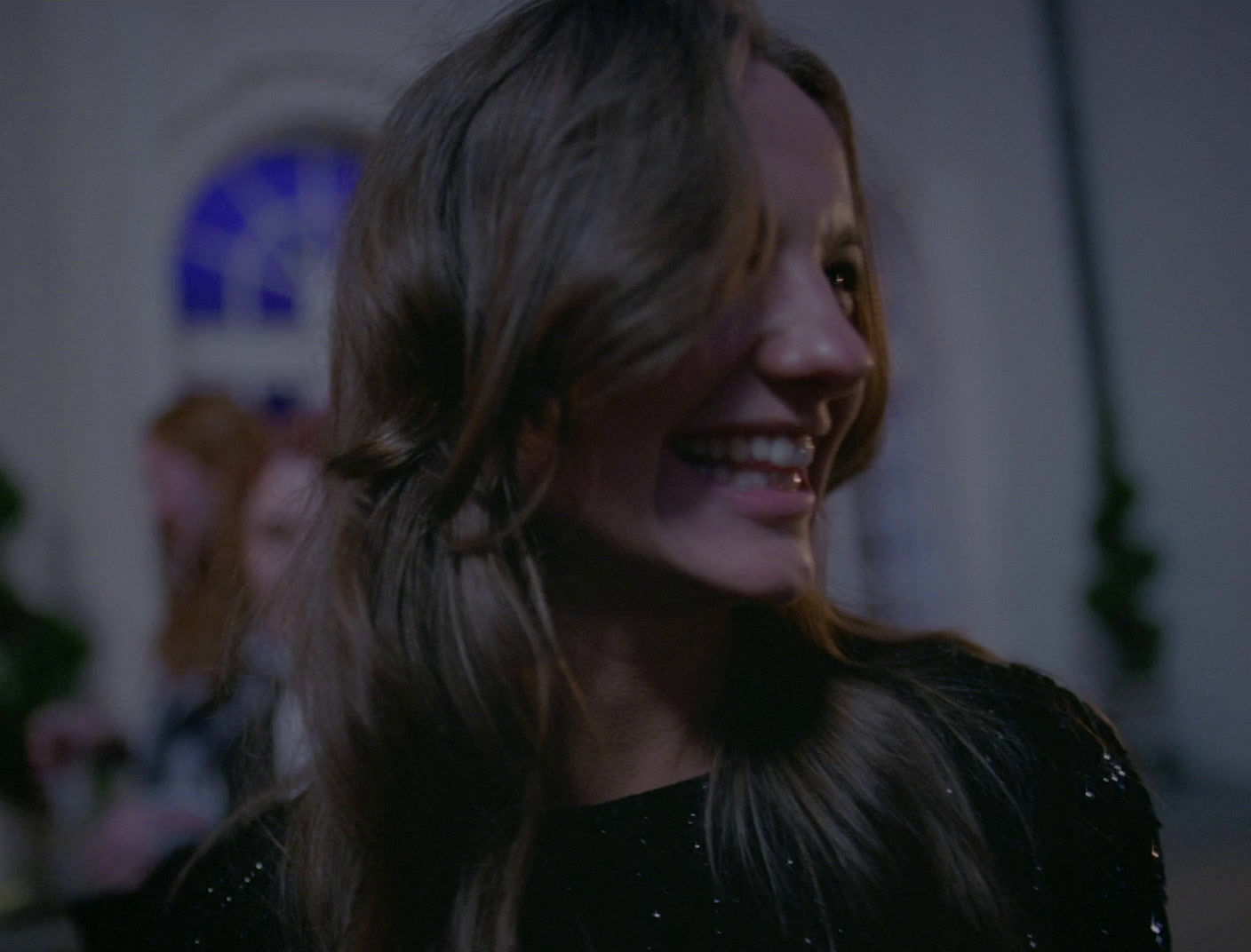 a close up of a person with long hair