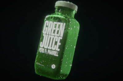 a bottle of green juice floating in the air