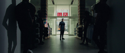 a man standing in the doorway of a library