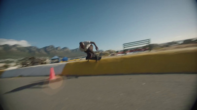 a man riding a skateboard down the side of a ramp