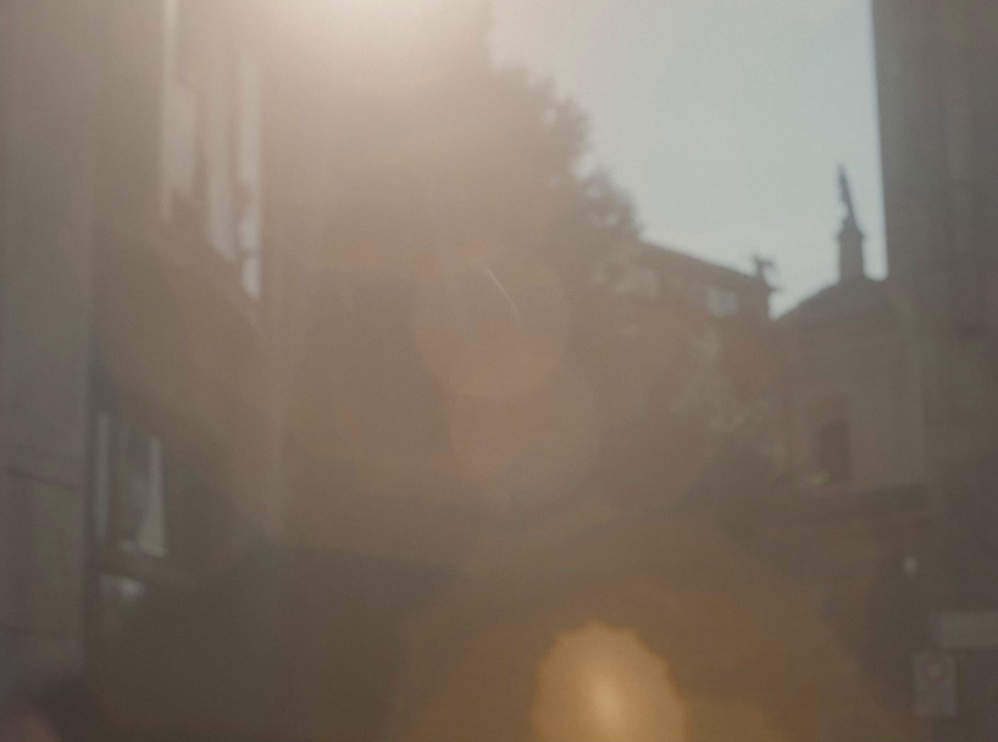 a blurry photo of a person standing in front of a building