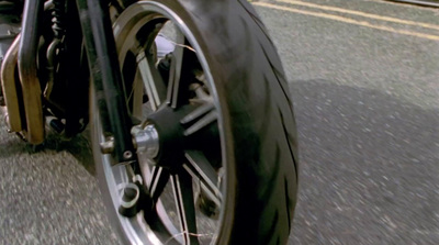 a close up of a motorcycle tire on a street