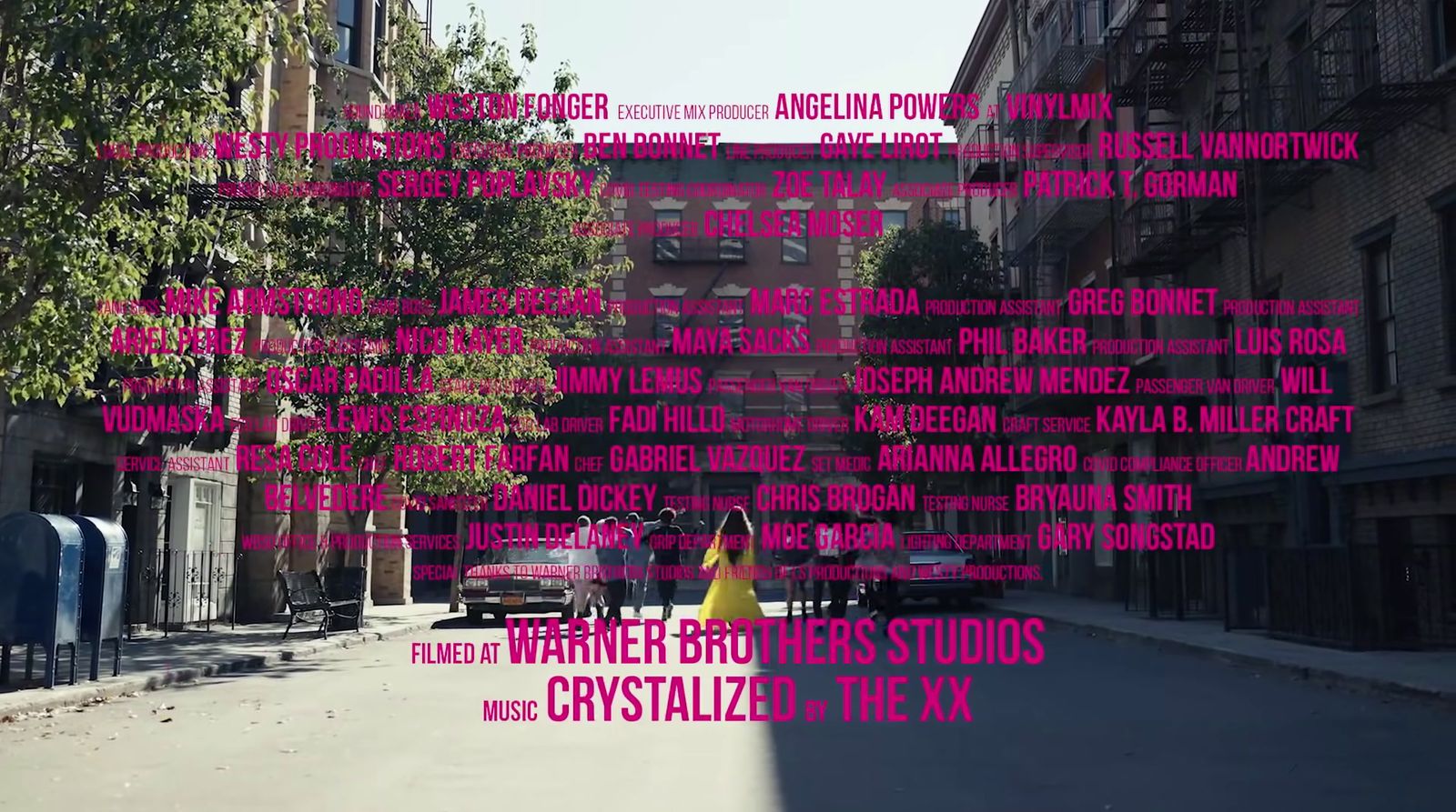 a city street filled with lots of pink text